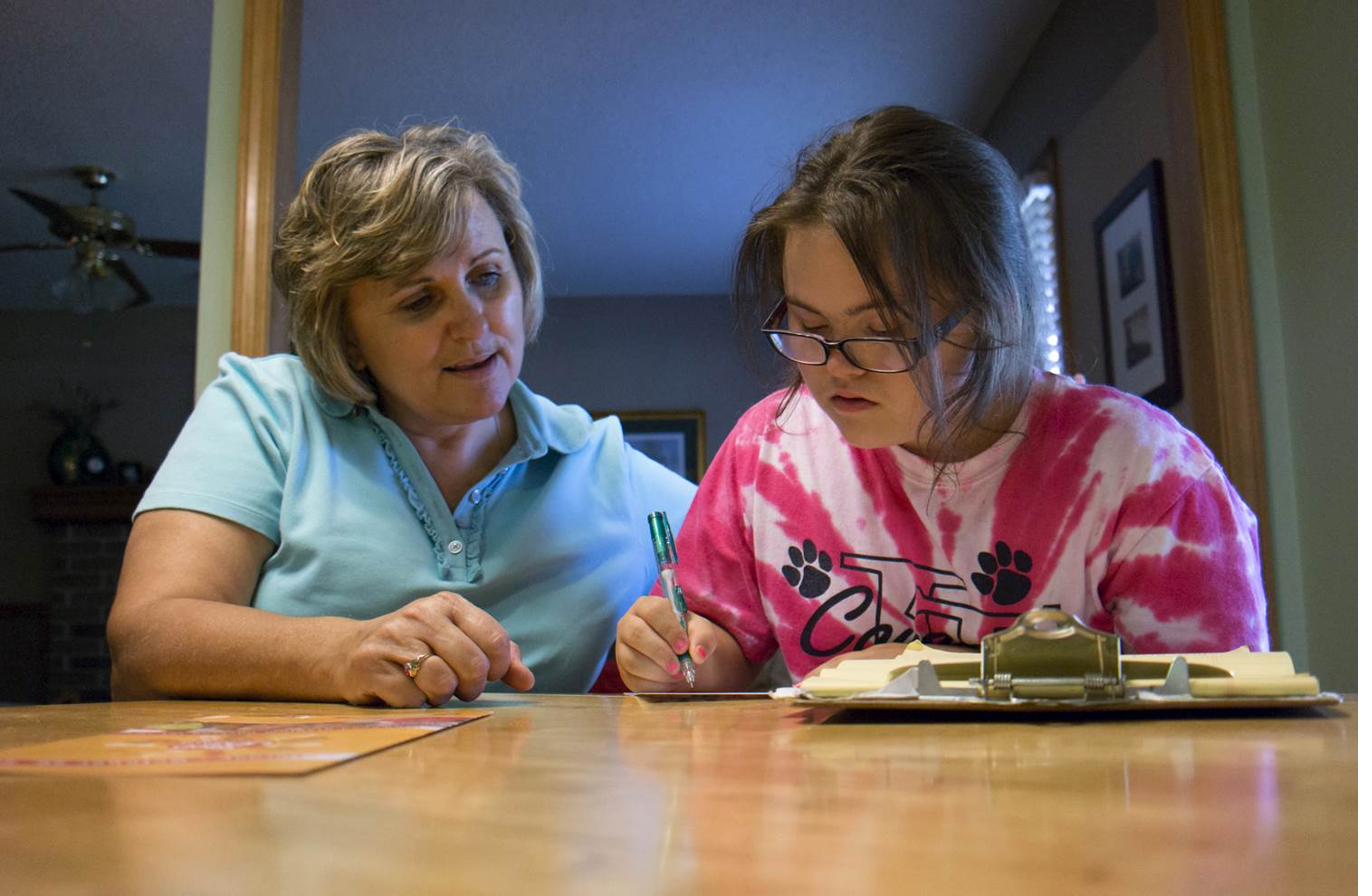 A support worker helping an individual build skills and independence
